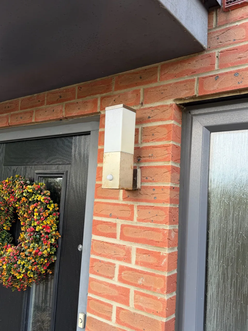 Existing non-working porch light before replacement